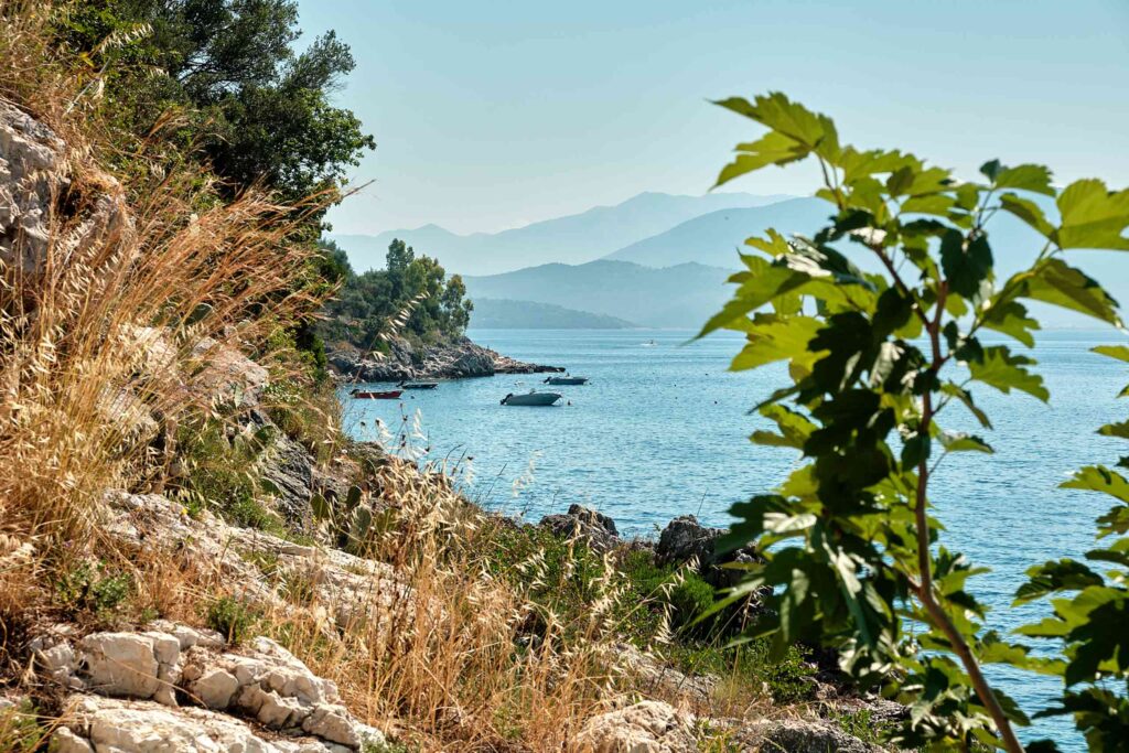 Corfu rustic view shot on a hike, with boats and hills in backdrop