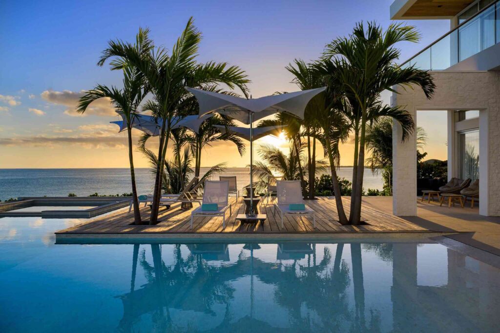 Sunset over private terrace and pool at Wymara Villas