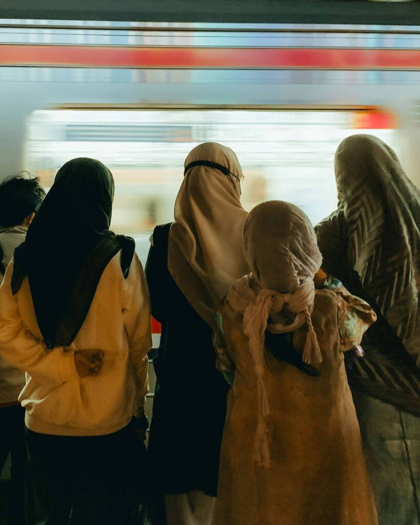Group of muslim women wait for the subway
