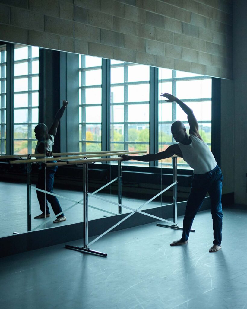 Folu Odimayo stretches in a ballet studio in London, UK