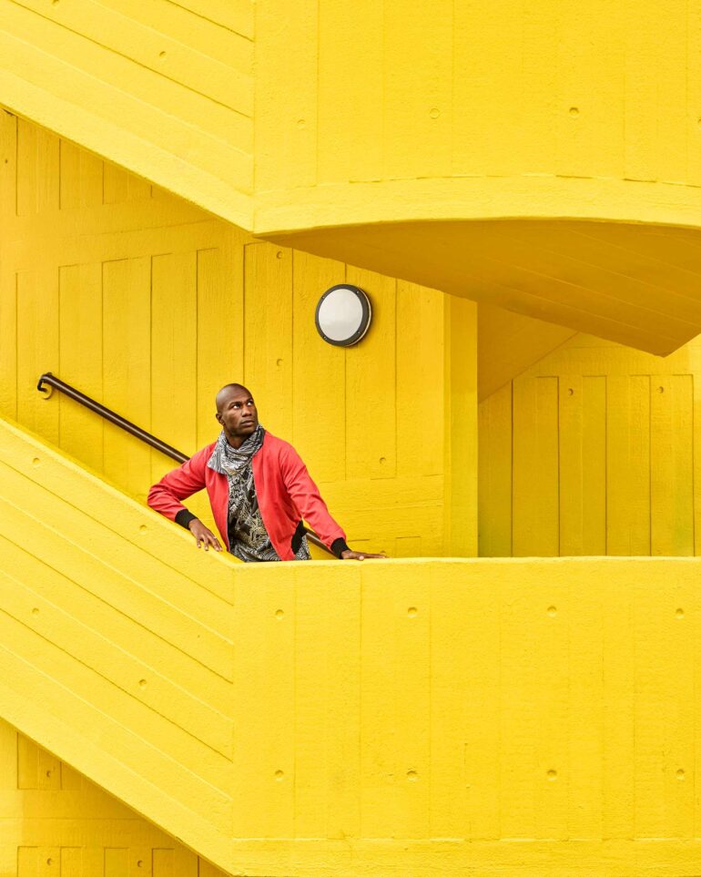 Folu Odimayo poses on an all-yellow stairway in London, UK