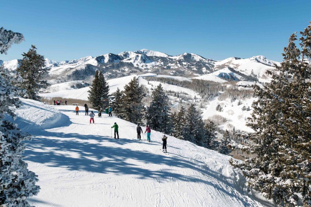 Skiers on the pistes of Deer Valley, Utah, USA, on a sunny day