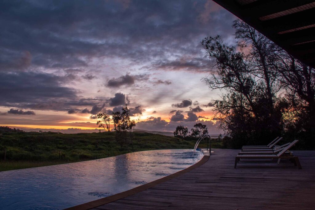 A curved outdoor pool on Easter Island, Chile, at dusk