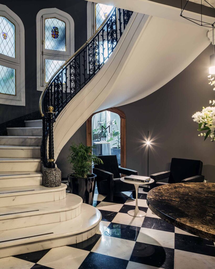 Marble staircase and a checkered floor in a 1929 renovated mansion in Santiago, Chile