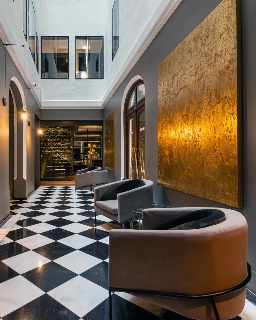 Checkered floor and contemporary furnishings at Hotel Magnolia, Santiago, Chile