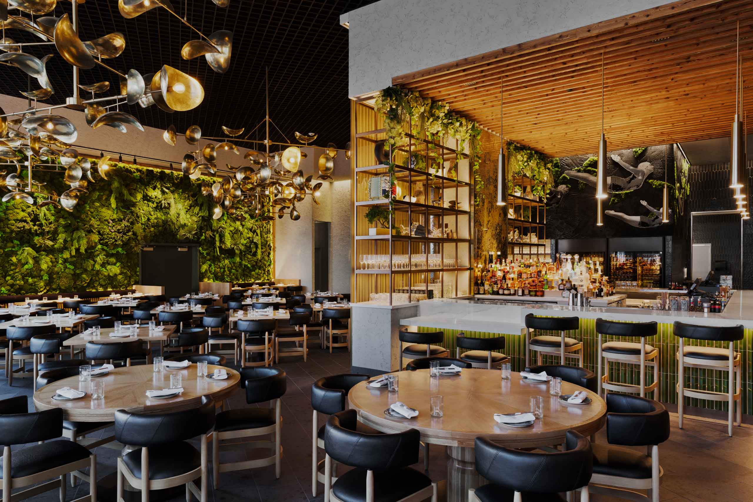 Interior design of KYU restaurant, contemporary round tables, near a bar