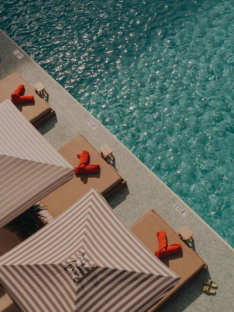 Poolside with cabana umbrellas at Mondrian Ibiza