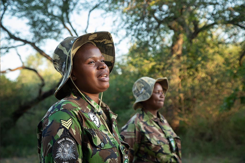 Two african women dressed in camouflage uniform and hat, they are members of the Black Mambas, the first all-female anti-poaching unit in Africa