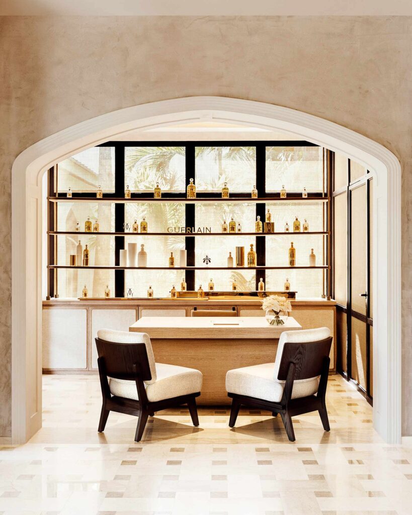 Two chairs in front of a desk inside the reception area at the Guerlain Spa at One&Only Le Saint Géran, Mauritius, designed by Clint Nagata of BLINK Design Group