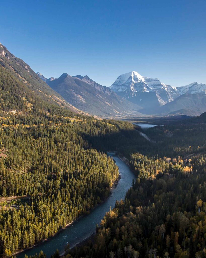 The Fraser River flowing towards a snow-capped mountain in British Columbia, Canada