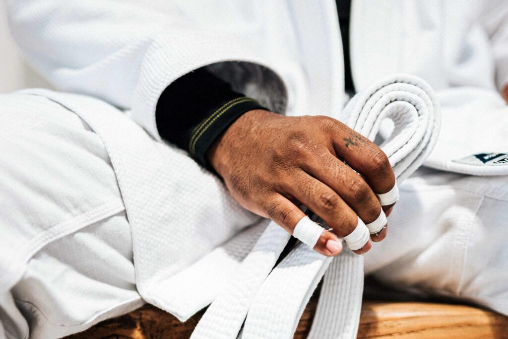 A close-up image of a participant's hand at a Brazilian Jiu Jitsu Camp