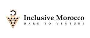 Inclusive Morocco logo, represented by an abstract triangular shape representing a Moroccan lantern the left, followed by the words "Inclusive Morocco". Under the words are more words – "Dare to venture"