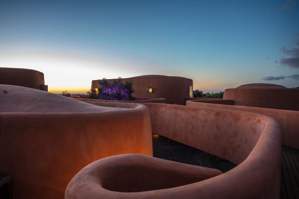 The curves of the terracota Villas at Is Molas, Sardinia at twilight