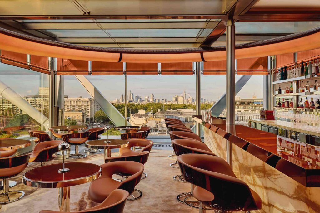 The Emory rooftop bar, with view across the contemporary bar and tables overlooking London