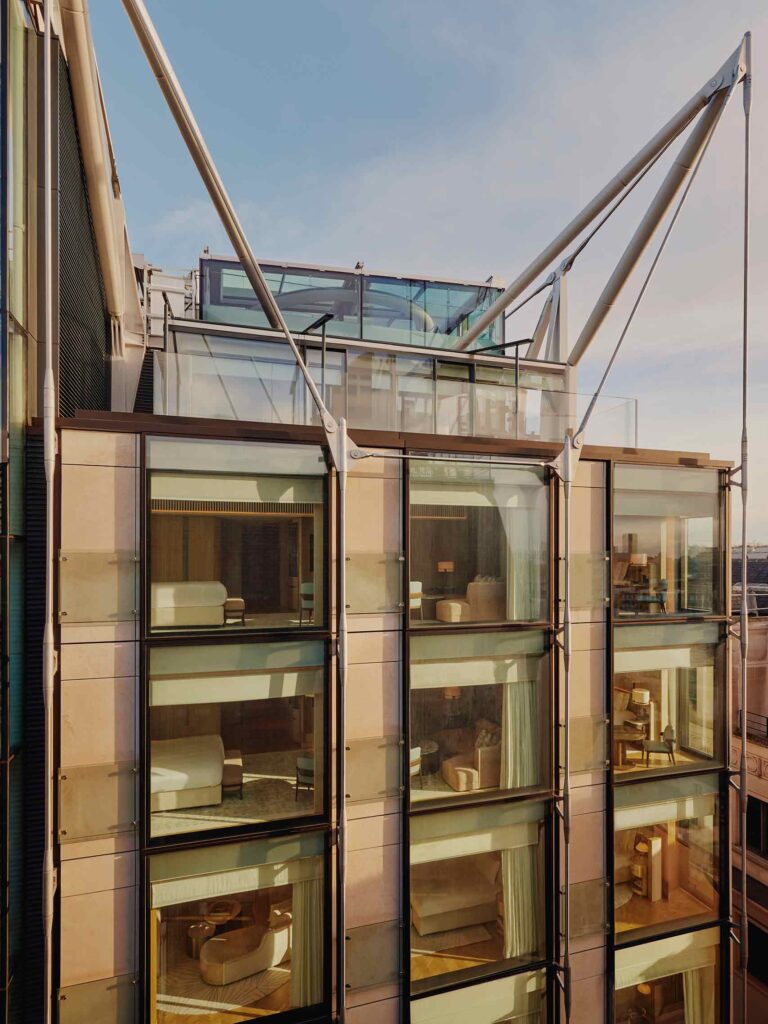 Richard Rogers designed building at the Emory London, birds eye view of top floors looking into the glass windows at the suites