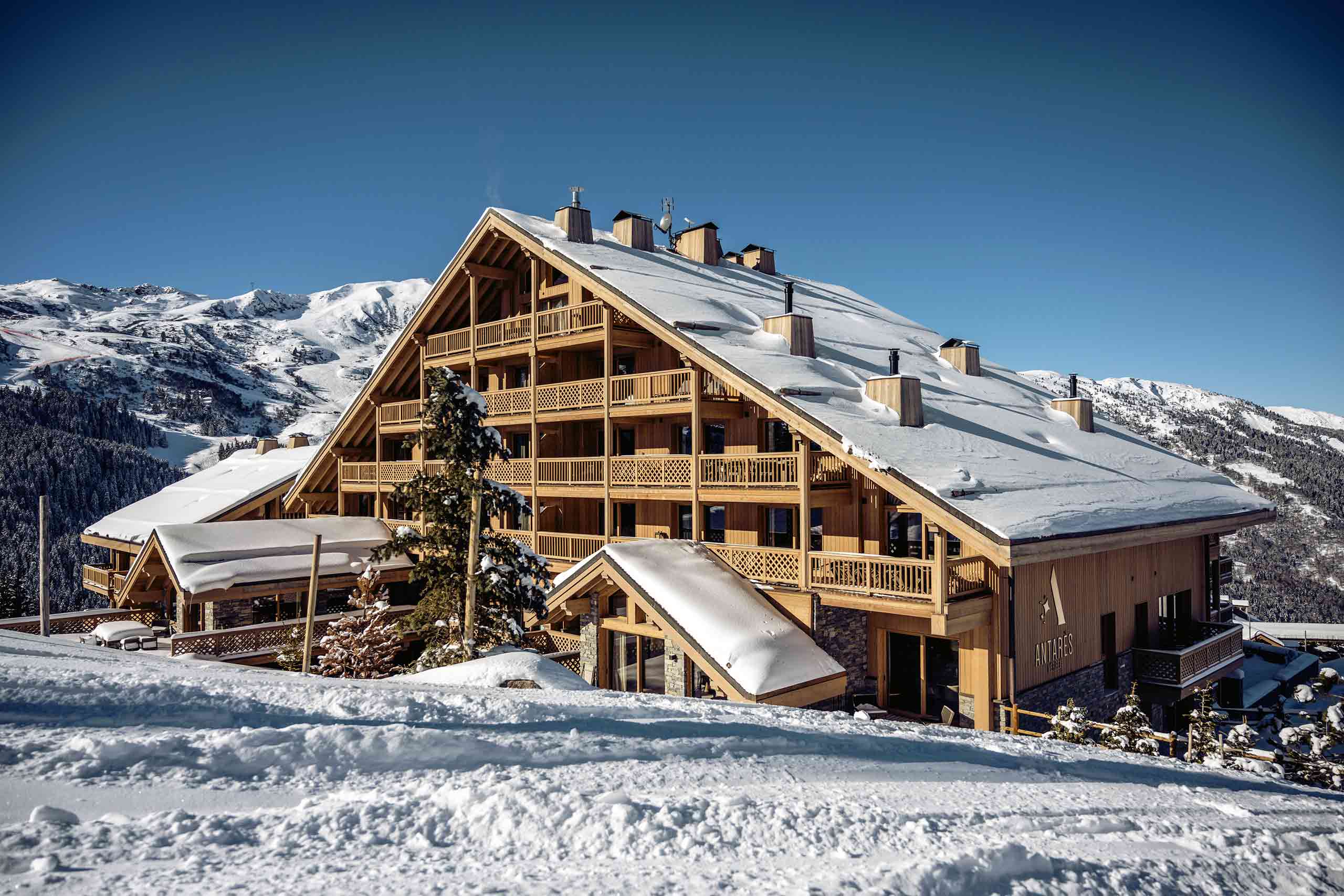 Exterior view of the chalet-style architecture of Antarès Méribel, Méribel, France