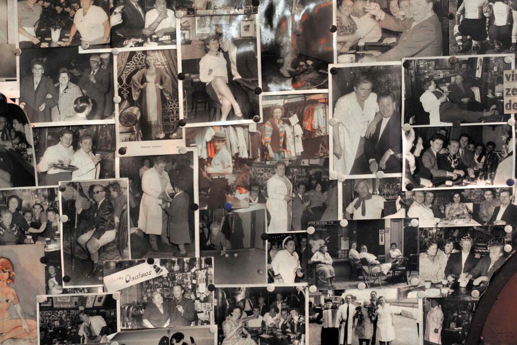 A collage of black and white photos show people celebrating at legendary queer Amsterdam venue Café 't Mandje, at the Amsterdam City Archive. The legacy of the city's queer community will be honoured during WorldPride 2026
