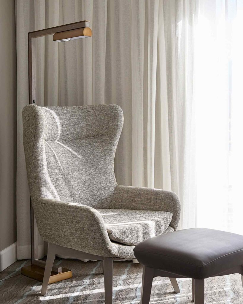 Mid century modern styling for a lamp, chair and ottoman at Hotel Paseo