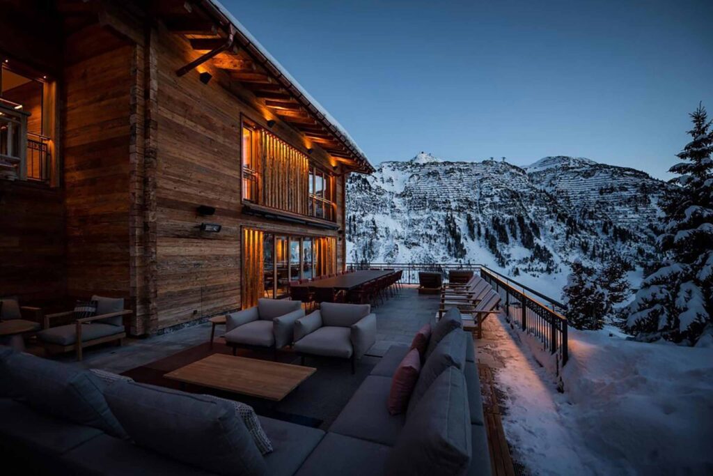 The Luxury Chalet Company chalet terrace with outdoor seating and dining
