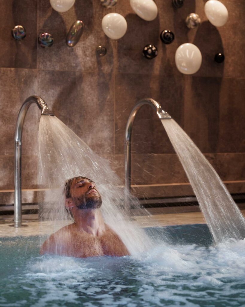 Man with a beard in a hydrotherapy pool on EXPLORA I