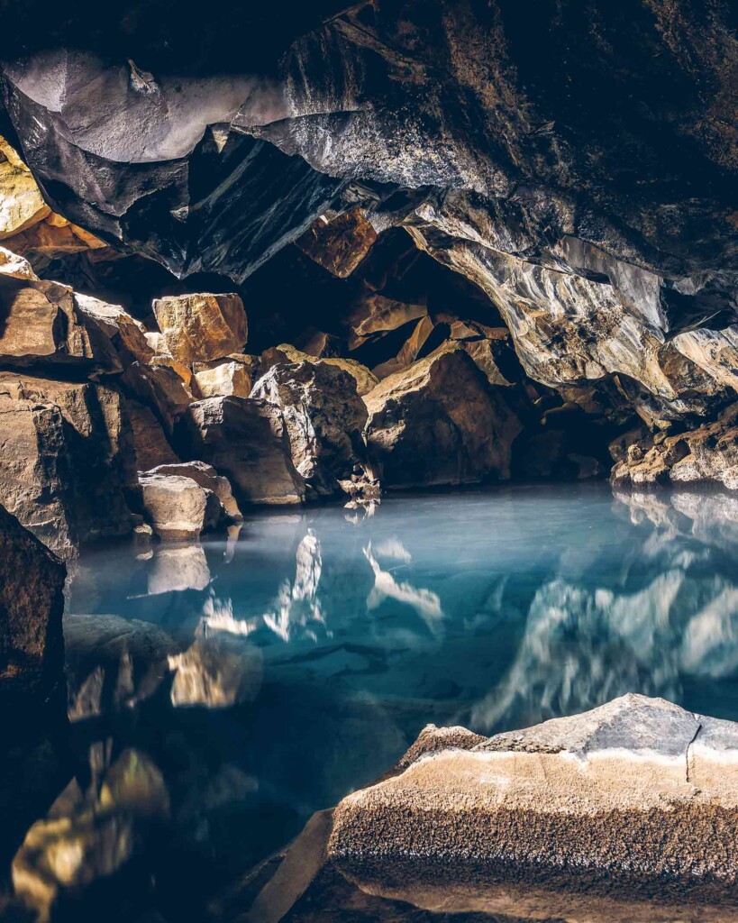 Beautiful volcanic cave systems in greece, with clear blue geothermal waters in Iceland – summer travel with Scott Dunn