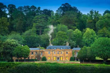 Smoke ascends from the chimney of Georgian manor Hadspen House, nowadays The Newt in Somerset, Bruton, United Kingdom
