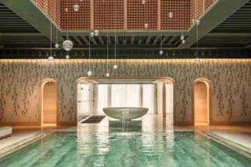 A water feature at the end of a pool above which glass spheres by Canadian brand Bocci float, Royal Mansour Tamuda Bay, Tamuda Bay, Morocco