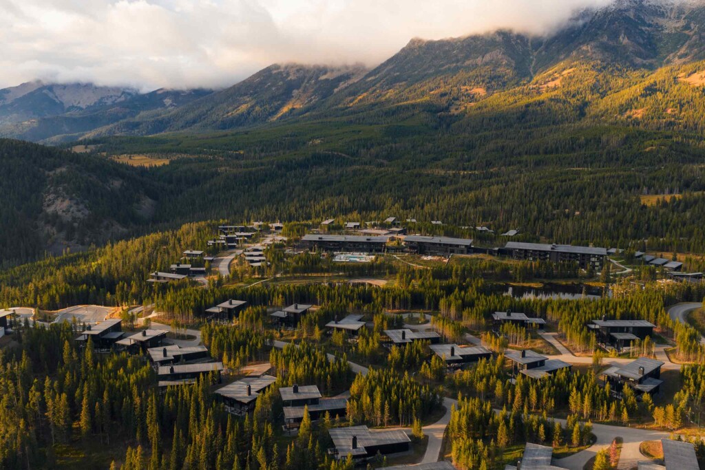 Aerial view of forested mountains home to the main lodge and guest villas at One&Only Moonlight Basin, Big Sky, Montana, USA