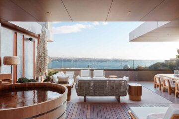 An ofuro bathtub and a large outdoor seating area on the private terrace of the Nobu Suite at The Ritz-Carlton, Istanbul, Türkiye