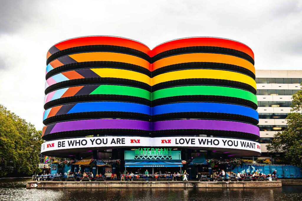 A building in the story features a Progress flag across its entire facade in support of WorldPride Amsterdam 2026