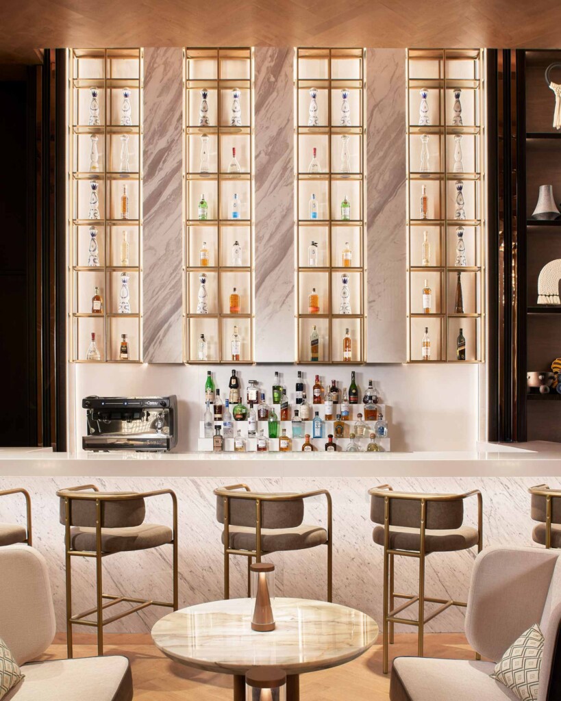 Colourful bottles are lined up behind the counter of a bar at Estacion 29, JW Marriott Hotel Mexico City Polanco, Mexico City, Mexico